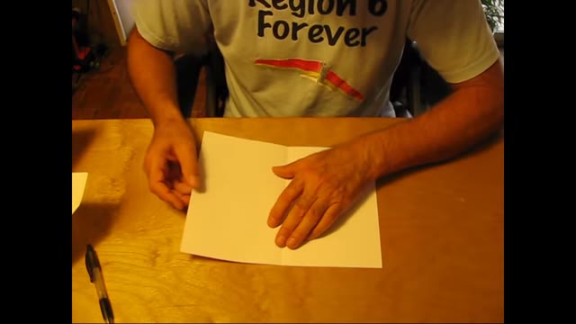The sheet opened with its center crease