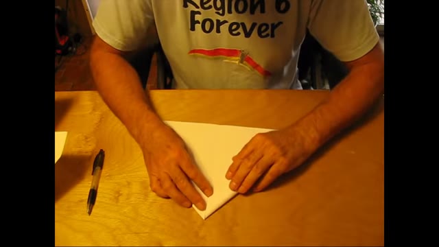 The first flap folded to the center line