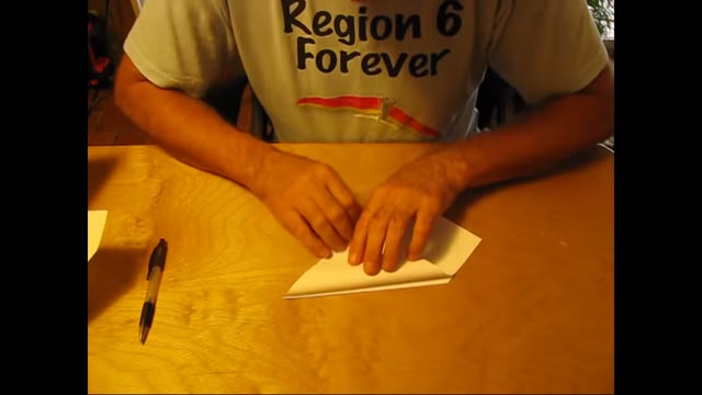 Folding the second flap with the sheet folded in half