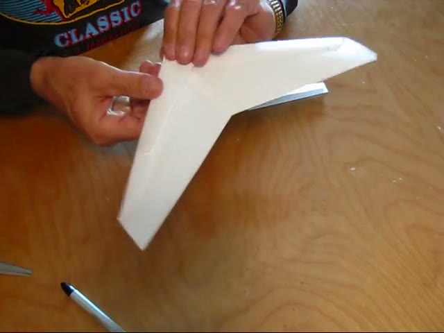 A leading-edge cover being positioned on the wing
